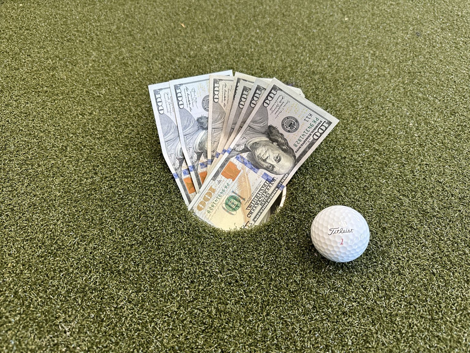 Golf group on the course with a live leaderboard for friendly wagers